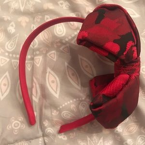 Red and black headband in excellent condition.